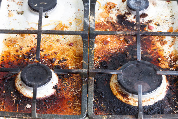 Before and after images of a stove top, demonstrating grease removal techniques